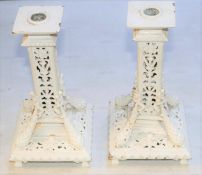 A pair of decorative heavy brass candlesticks. Overpainted in white. GC. £30-50