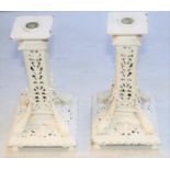 A pair of decorative heavy brass candlesticks. Overpainted in white. GC. £30-50