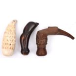 3 assorted kris hilts. Comprising one from Madura made from clam shell and geometrically carved, and