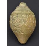 A heavy pale-couloured pottery fire grenade. Probably 13th or 14th century14.5cms, of conventional