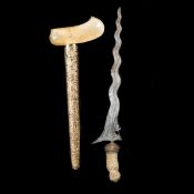 A Balinese dagger kris. Wavy blade with crowned naga probably 19th century (acid cleaned), bone