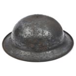 An unusual WWII steel helmet, with turned over edge to rim, painted black, with liner and chinstrap.