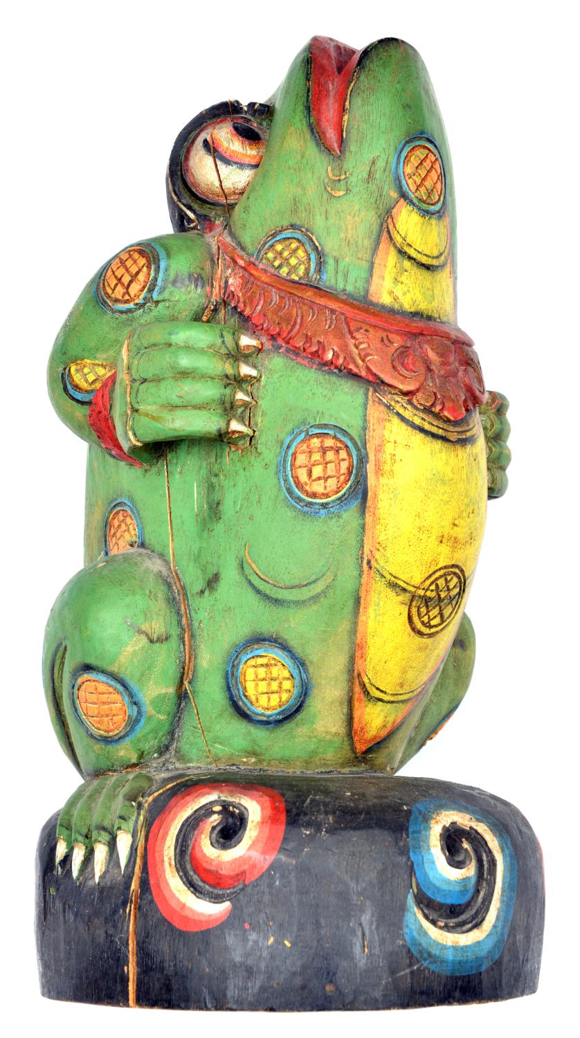 A Balinese polychrome painted wooden kris stand. 41cms, carved from a single piece of wood in the