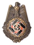 A Third Reich Teno decoration, bronzed with silver, gilt and enamel centre, the centre marked on the