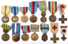 France: Geneva Cross 1870-71 (2) and 1 miniature of the same; WWI Victory medal; Orient medal 1915-