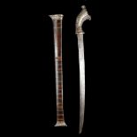An Indonesian short sword parang. Second half of the 19th century, slightly curved SE pattern welded
