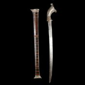 An Indonesian short sword parang. Second half of the 19th century, slightly curved SE pattern welded
