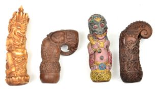 4 assorted kris hilts. Comprising 2 from Bali, the first wooden carved and painted with a polychrome