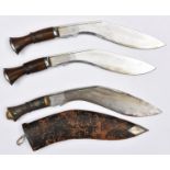 A kukri, blade 12" studded hilt, WM lion head pommel, in sheath; 2 other kukris, plated blades, 11",