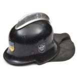 A Third Reich Fire Service double decal steel helmet, the black skull having ventilation holes,