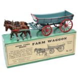A Britains Home Farm Series Farm Waggon (No.5F). A lead 4-wheel wagon in light blue with red