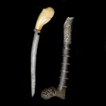 A Malayan dagger tumbok lada. Late 19th century, curved single edge blade 16cms, swollen bone hilt
