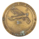 A Third Reich DLV oxidised brass medallion, 60mm diam, the obverse bearing a depiction of a Pflaz