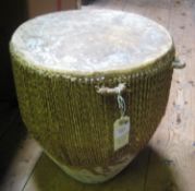 A heavy cup shaped drum, skin covered top with multi cord stretchers to base, diam 14", height