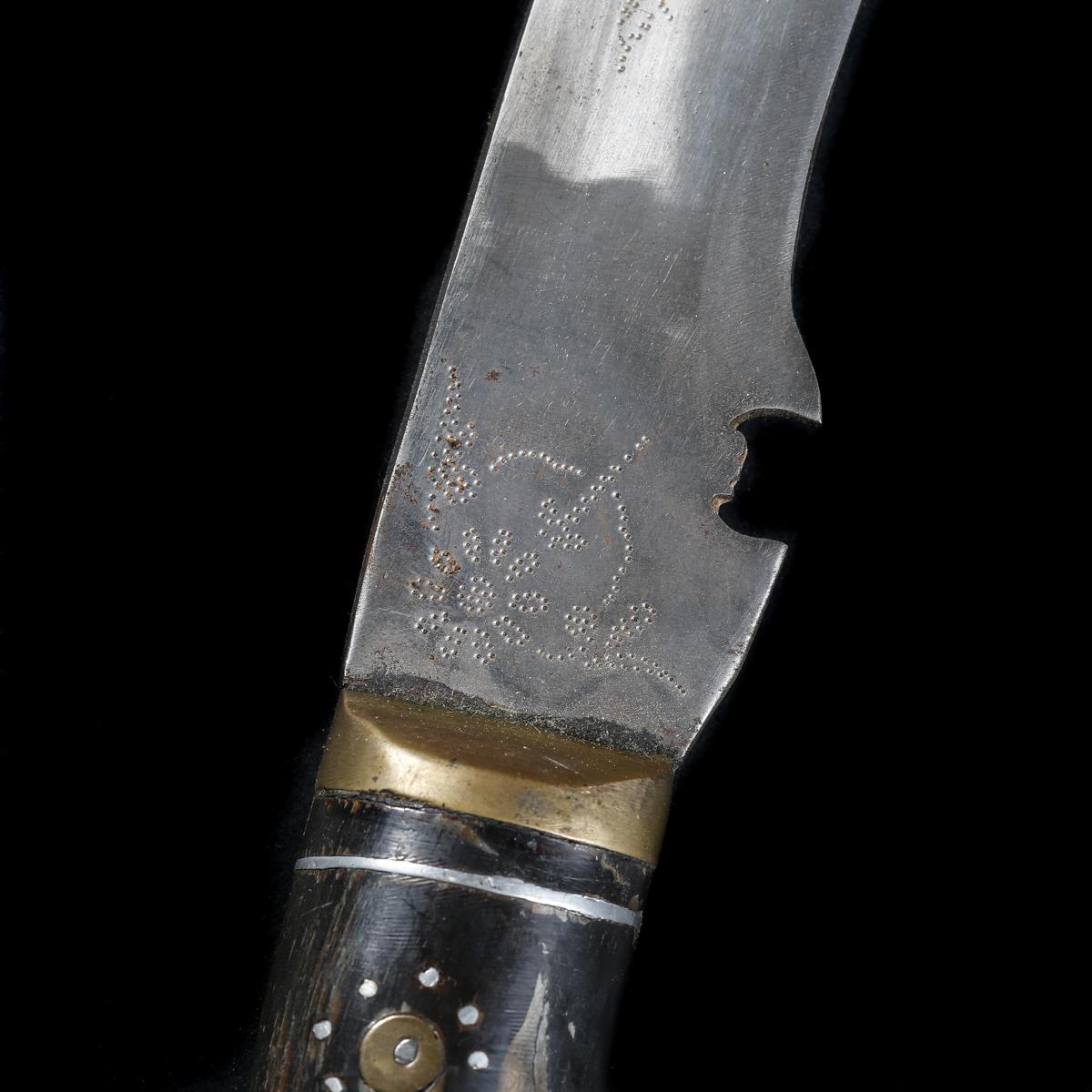 A large Indian kukri. 20th century, blade 51.5cms stamped 'India', horn hilt with brass mounts - Image 3 of 3