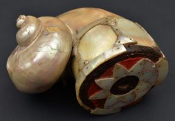 An Indian powder flask barutdan. Made from the shell of a green sea snail (turbo marmoratus),