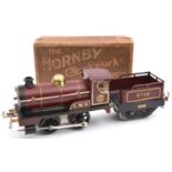 An early Hornby O gauge clockwork No.1 0-4-0 tender locomotive. Example with brass buffers and