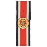 A Third Reich Naval gilt Honour Roll clasp, mounted on a length of 2nd class Iron Cross ribbon. GC