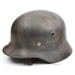 A Third Reich M40 steel helmet, the interior with original Luftwaffe grey/blue finish, the