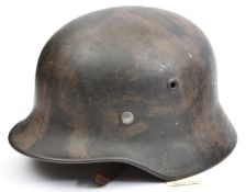 A Third Reich M40 steel helmet, the interior with original Luftwaffe grey/blue finish, the