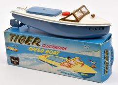 A Sutcliffe tinplate Tiger clockwork Speed Boat. In white and light blue livery, with propeller