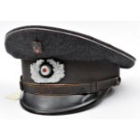 A Third Reich Red Cross NCO?s peaked cap, with light grey piping, dark grey band, aluminium cockade,