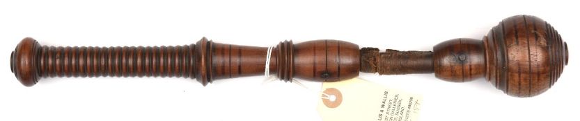 An early 19th century polished hardwood cosh, line incised ball on barrel-neck head, leather (split)