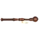 An early 19th century polished hardwood cosh, line incised ball on barrel-neck head, leather (split)