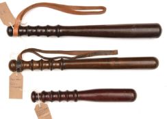 A detective's short, darkwood truncheon, 1930-40's, shaped grip, 10½" overall; a turned darkened