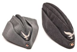 A Third Reich Luftwaffe grey/blue wool side cap, with embroidered eagle and cockade, the lining