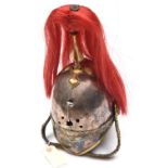 A dragoon trooper's helmet, silver plated skull, ear to ear wreath, and oak leaf braid at the
