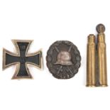 A 1914 Iron Cross 1st class, of light weight construction with ferrous centre; a WWI black wound