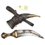 An Indian Arab jambiya, blade 8" with central ridge, the horn hilt partly covered with sheet brass