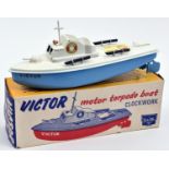 A Sutcliffe tinplate clockwork Victor Motor Torpedo Boat. In white and light blue livery, with