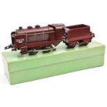 A scarce French Hornby O gauge 3 rail electric 0-4-0 SNCF tender locomotive in maroon livery with