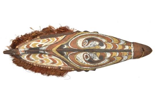 A New Guinea (Sepik River area) wooden shield, of elliptical form and carved with a stylised human - Image 2 of 2