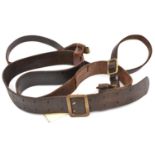 A Third Reich officer's brown leather belt with cross strap, the belt having a brass buckle with