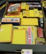 A quantity of Atlas Dinky and other Dinky related items. Including Caravan (811), Renault