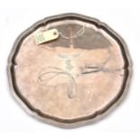 A silver plated salver, 14" diam, with gadrooned edges, the centre engraved with a Luftwaffe eagle