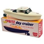 A Sutcliffe tinplate clockwork Sprite day cruiser. In cream and dark green livery, with propeller