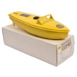 A very late issue Sutcliffe tinplate clockwork COMET speed boat. In bright yellow livery, complete