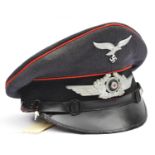 A Third Reich Luftwaffe flak section NCO's peaked cap, with red piping, aluminium cockade and eagle,