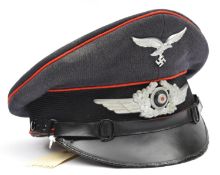 A Third Reich Luftwaffe flak section NCO's peaked cap, with red piping, aluminium cockade and eagle,