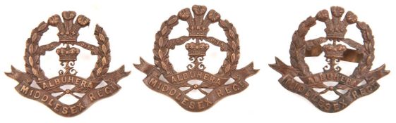 An officer's bronze cap badge and pair collars of The Middlesex Regt. Near VGC .