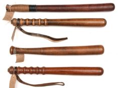 2 brown wood truncheons, c 1950's, sloped grips, wrist straps stamped Hiatt, 16" overall; another