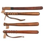 2 brown wood truncheons, c 1950's, sloped grips, wrist straps stamped Hiatt, 16" overall; another