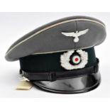 A Third Reich Infantry NCO's peaked cap, with aluminium cockade and eagle, patent leather chinstrap,