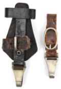 A Third Reich vertical hanger for an SS dagger, of black leather with nickel silver spring clip; and