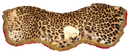 A Victorian officer?s leopard skin saddle cloth of the 10th Hussars, gilt tassels on scalloped,