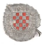 A scarce Third Reich Croatian Legion members pin back badge, of aluminium with red painted diced